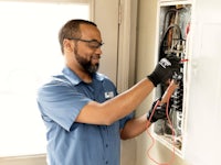 a man working on an electrical panel